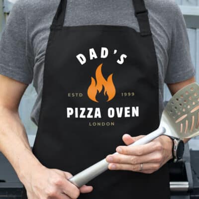 Personalised Pizza Flame Apron in black on a father with spatula