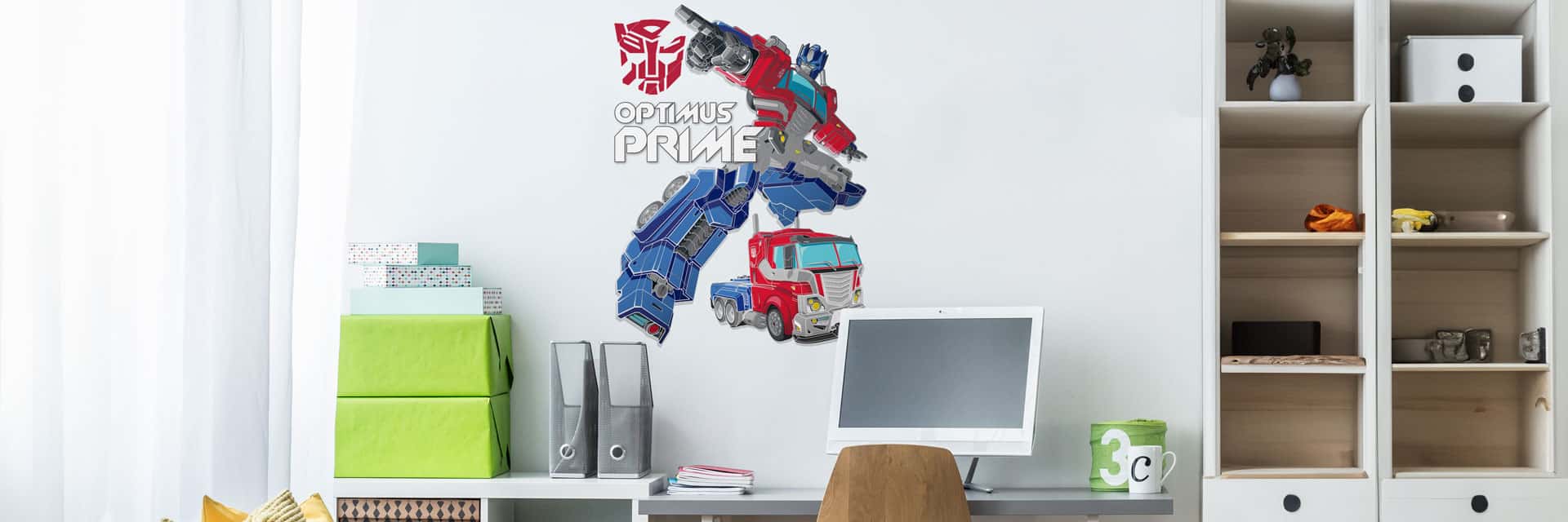 Official Transformers wall stickers above a boy's desk in a bedroom
